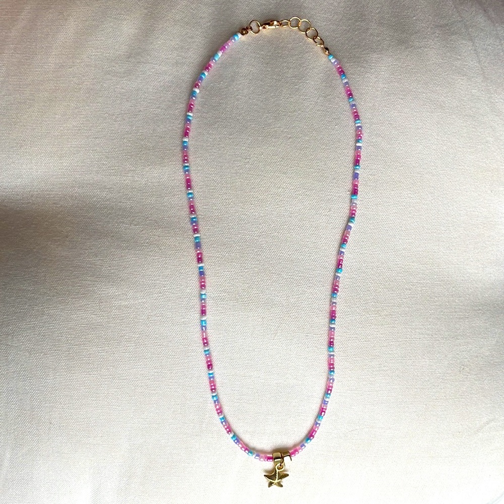 Multicolored beaded necklace with gold starfish charm